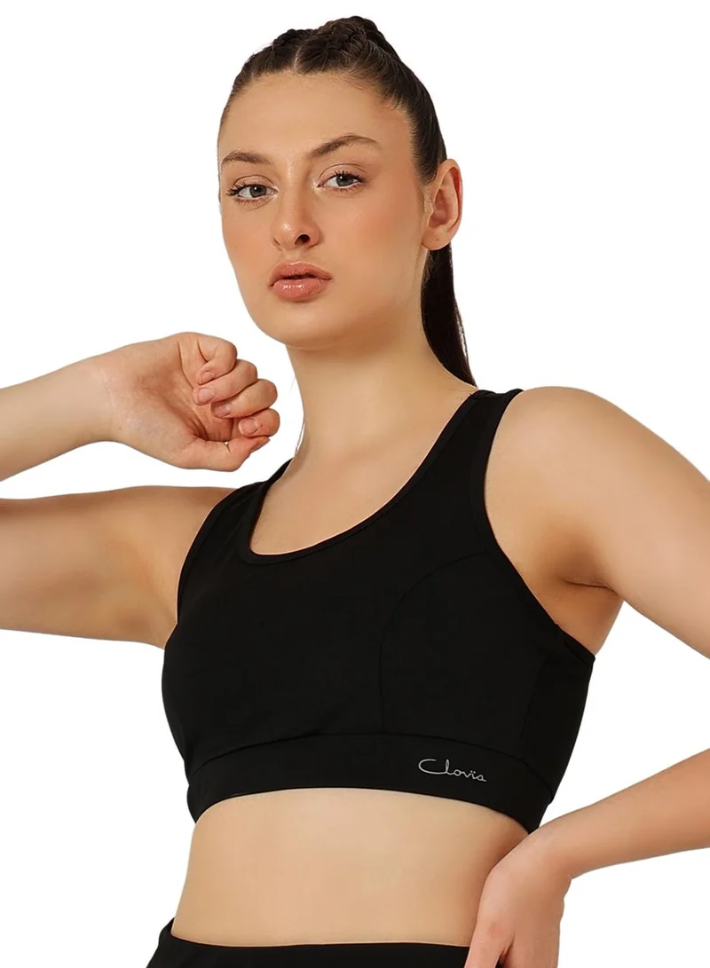 Clovia Black Medium Impact Padded Racerback Sports Bra in Black for Women | Best Price UAE
